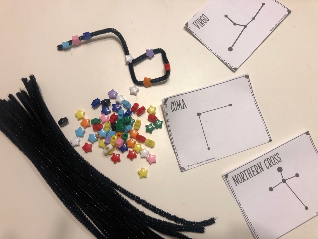 This is a picture of pipe cleaners, star beads, and constellations.